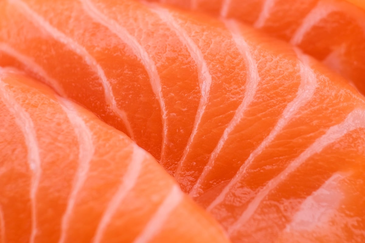 Fresh, juicy salmon cut into pieces for sashimi